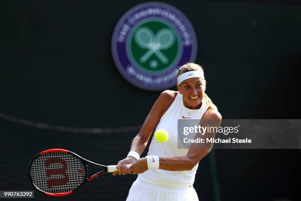 Petra Kvitova of Czech Republic returns against Aliaksandra Sasnovich of Belarus during their Ladies' Singles first round match on day two of the...