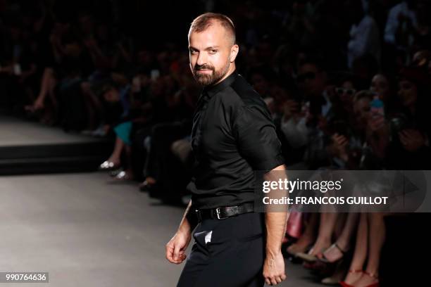 French fashion designer Julien Fournie acknowledges the audience at the end of his 2018-2019 Fall/Winter Haute Couture collection fashion show in...