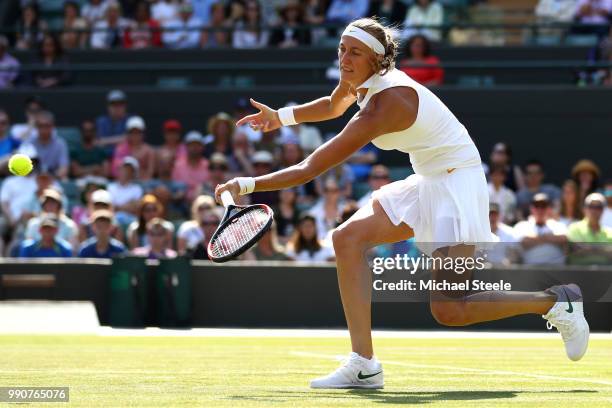 Petra Kvitova of Czech Republic returns against Aliaksandra Sasnovich of Belarus during their Ladies' Singles first round match on day two of the...