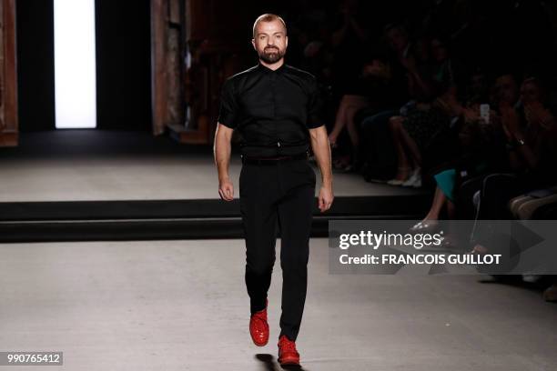 French fashion designer Julien Fournie acknowledges the audience at the end of his 2018-2019 Fall/Winter Haute Couture collection fashion show in...