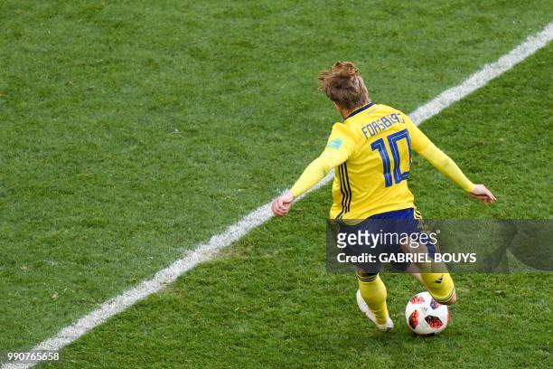 Sweden's midfielder Emil Forsberg kicks and scores during the Russia 2018 World Cup round of 16 football match between Sweden and Switzerland at the...
