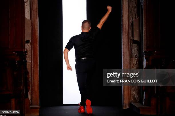 French fashion designer Julien Fournie dances at the end of his 2018-2019 Fall/Winter Haute Couture collection fashion show in Paris, on July 3, 2018.