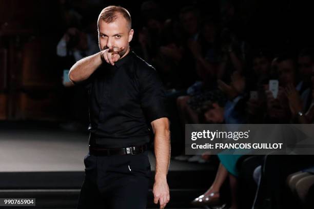 French fashion designer Julien Fournie acknowledges the audience at the end of his 2018-2019 Fall/Winter Haute Couture collection fashion show in...