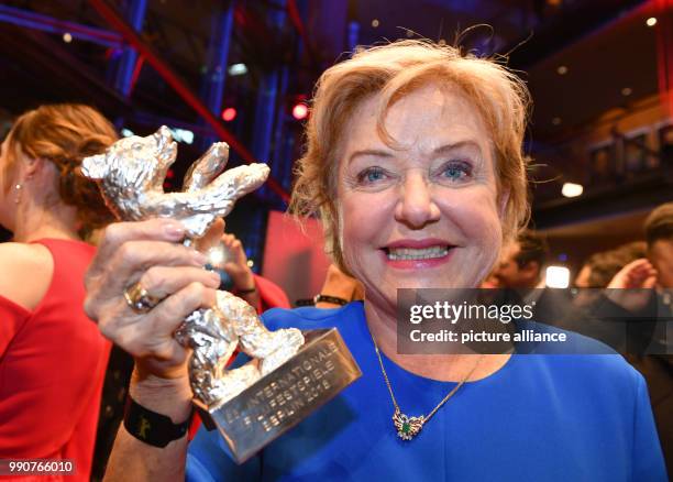 February 2018, Germany, Berlin, Award Ceremony, Berlinale Palace: Actress Ana Brun from Paraguay holds her silver bear for Best Actress for her...