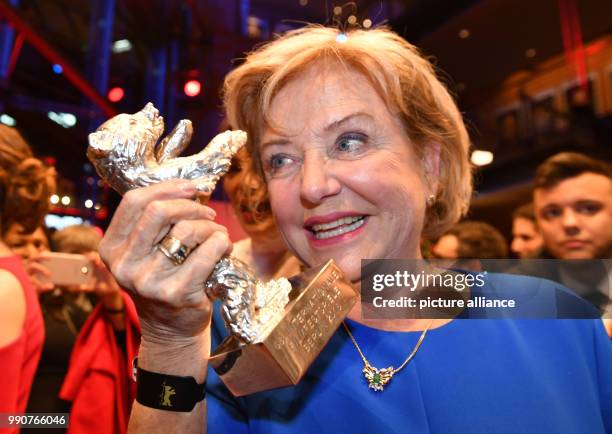 February 2018, Germany, Berlin, Award Ceremony, Berlinale Palace: Actress Ana Brun from Paraguay holds her silver bear for Best Actress for her...