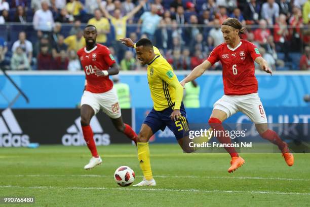 Martin Olsson of Sweden is fouled by Michael Lang of Switzerland just outside the peanlty area during the 2018 FIFA World Cup Russia Round of 16...