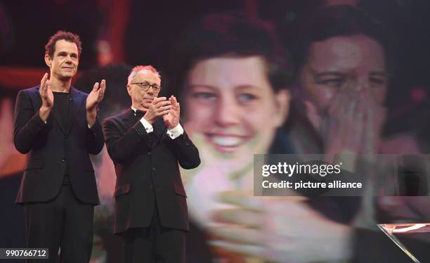 February 2018, Germany, Berlin, Award Ceremony, Berlinale Palace: This year's Berlinale jury president Tom Tykwer and Dieter Kosslick, director of...