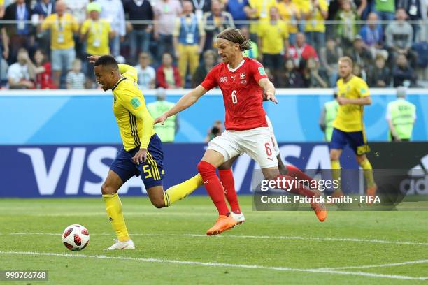 Martin Olsson of Sweden is fouled by Michael Lang of Switzerland just outside the peanlty area during the 2018 FIFA World Cup Russia Round of 16...