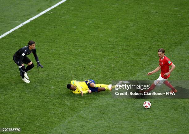 Martin Olsson of Sweden is fouled by Michael Lang of Switzerland just outside the peanlty area during the 2018 FIFA World Cup Russia Round of 16...