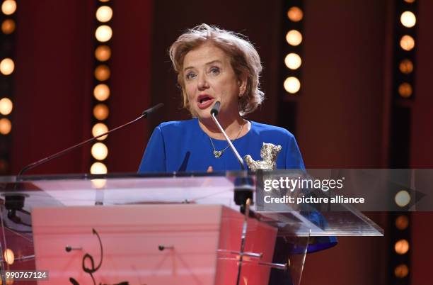 February 2018, Germany, Berlin, Award Ceremony, Berlinale Palace: Actress Ana Brun from Paraguay holds her silver bear for Best Actress for her...