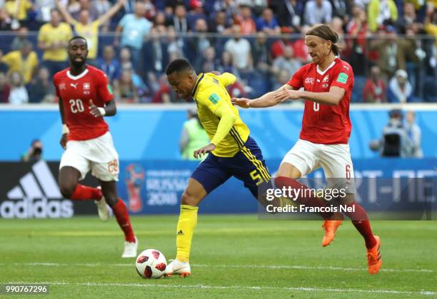 Martin Olsson of Sweden is fouled by Michael Lang of Switzerland leading to Michael Lang of Switzerland recieving a red card, and after a VAR review,...