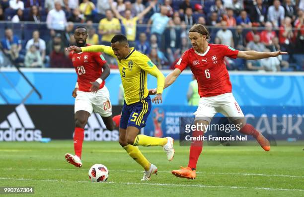 Martin Olsson of Sweden is fouled by Michael Lang of Switzerland leading to Michael Lang of Switzerland recieving a red card, and after a VAR review,...