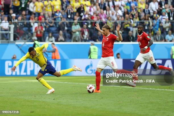 Martin Olsson of Sweden is fouled by Michael Lang of Switzerland leading to Michael Lang of Switzerland recieving a red card, and after a VAR review,...