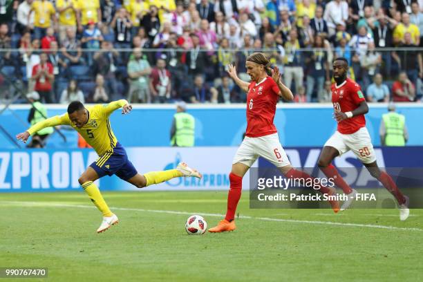 Martin Olsson of Sweden is fouled by Michael Lang of Switzerland just outside the peanlty area during the 2018 FIFA World Cup Russia Round of 16...