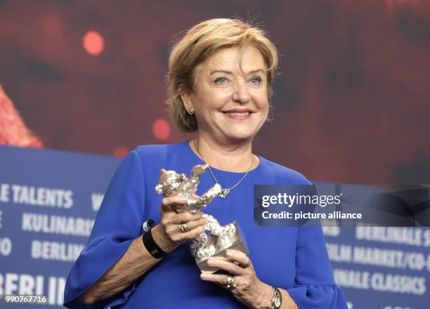 February 2018, Germany, Berlin, Award Ceremony, Berlinale Palace: Actress Ana Brun from Paraguay holds her silver bear for Best Actress for her...