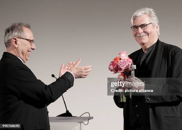 Actor Peter Simonischek Berlinale receives the "Berlinale Camera" award on behalf of Czech director Jiri Menzel from Belrinale Director Dieter...