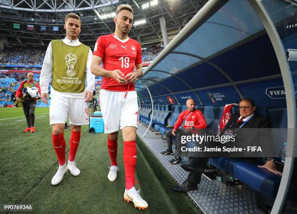 Nico Elvedi of Switzerland and Josip Drmic of Switzerland look dejected following their sides defeat in the 2018 FIFA World Cup Russia Round of 16...