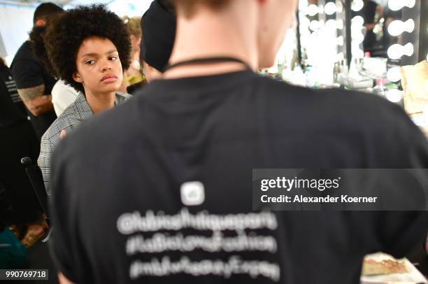 Model prepares backstage ahead of the Lena Hoschek show during the Berlin Fashion Week Spring/Summer 2019 at ewerk on July 3, 2018 in Berlin, Germany.