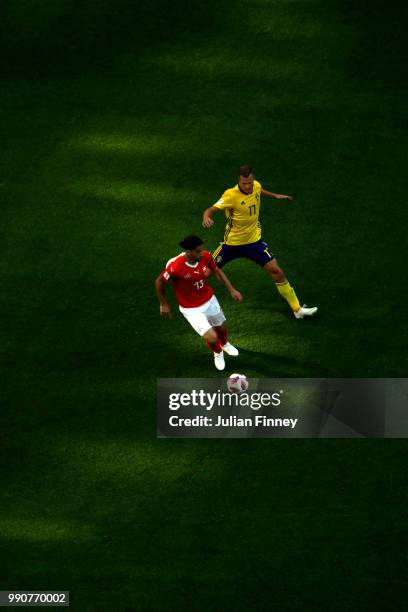 Ricardo Rodriguez of Switzerland is challenged by Viktor Claesson of Sweden during the 2018 FIFA World Cup Russia Round of 16 match between Sweden...