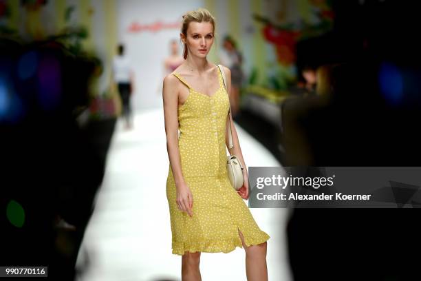 Model walks the runway ahead of the Lena Hoschek show during the Berlin Fashion Week Spring/Summer 2019 at ewerk on July 3, 2018 in Berlin, Germany.