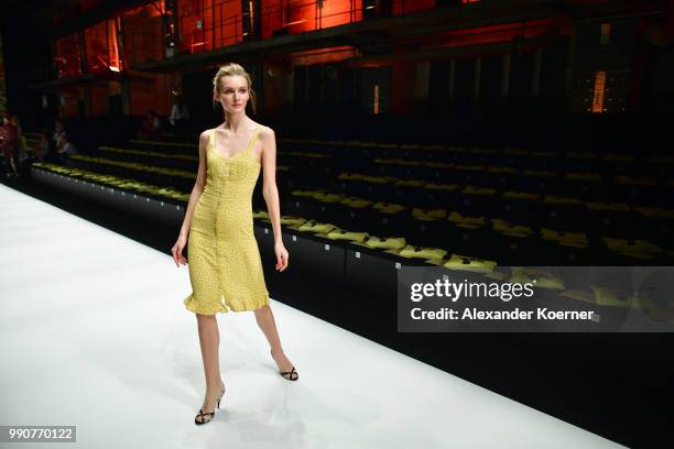 Model walks the runway ahead of the Lena Hoschek show during the Berlin Fashion Week Spring/Summer 2019 at ewerk on July 3, 2018 in Berlin, Germany.