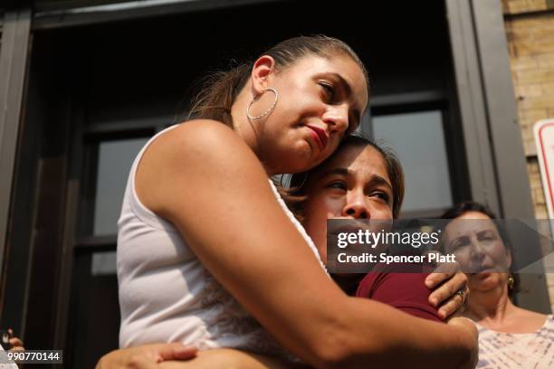 Yeni Maricela Gonzalez Garcia stands with Janey Pearl as she speaks with the news media following a visit with her children at the East Harlem Cayuga...