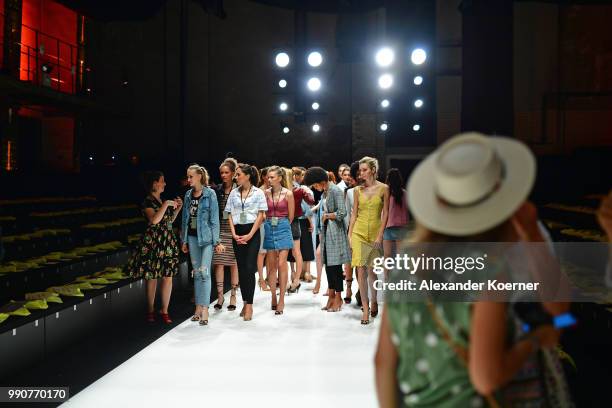 Models on the runway ahead of the Lena Hoschek show during the Berlin Fashion Week Spring/Summer 2019 at ewerk on July 3, 2018 in Berlin, Germany.