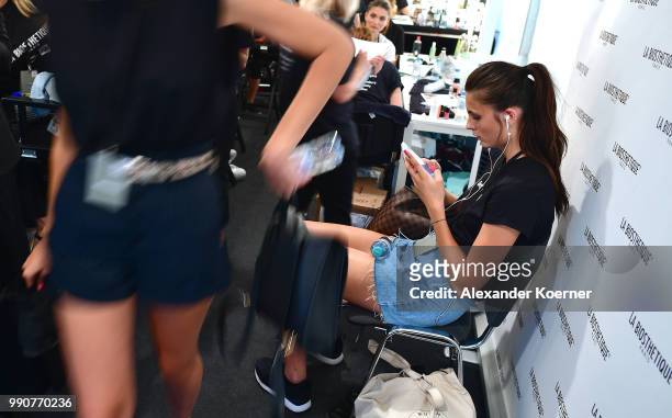 Models are seen backstage ahead of the Lena Hoschek show during the Berlin Fashion Week Spring/Summer 2019 at ewerk on July 3, 2018 in Berlin,...