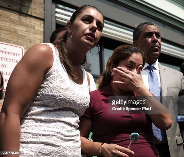 Yeni Maricela Gonzalez Garcia stands with Janey Pearl and Democratic Congressman Adriano Espaillat as she speaks with the news media following a...