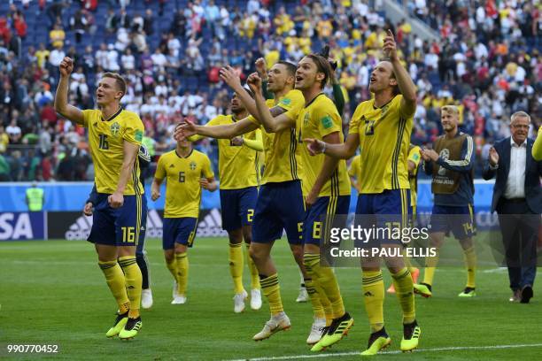 Sweden's players celebrate their victory at the end of the Russia 2018 World Cup round of 16 football match between Sweden and Switzerland at the...