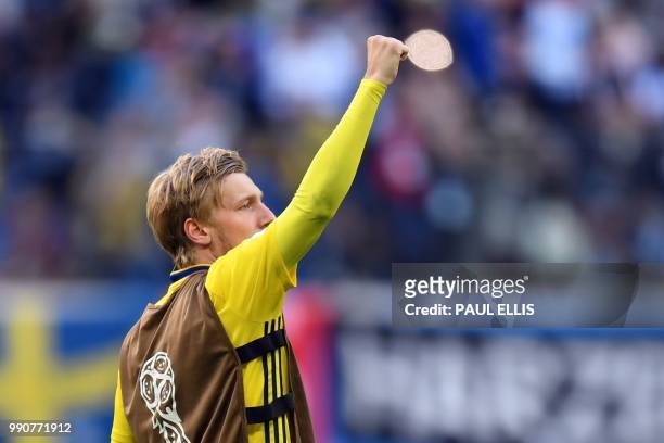 Sweden's midfielder Emil Forsberg celebrates their victory at the end of the Russia 2018 World Cup round of 16 football match between Sweden and...