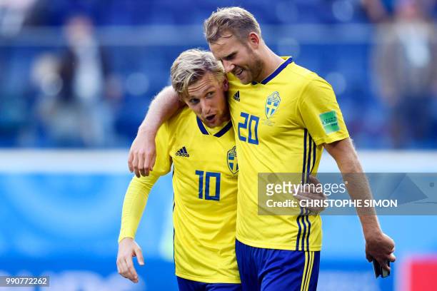 Sweden's forward Ola Toivonen and Sweden's midfielder Emil Forsberg celebrate at the end of the Russia 2018 World Cup round of 16 football match...