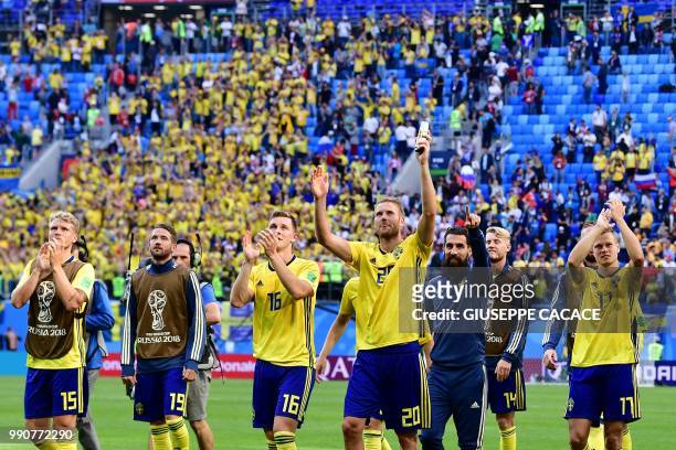 Sweden's players celebrate their victory in the Russia 2018 World Cup round of 16 football match between Sweden and Switzerland at the Saint...