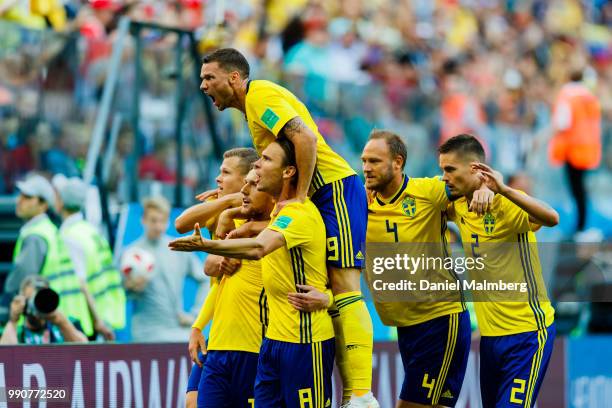 Emil Forsberg of Sweden celebrates scoring goal 1-0, the result of the game, together with his teammates during the 2018 FIFA World Cup Russia Round...