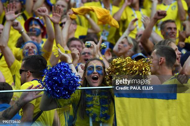 Sweden's fans celebrate their victory at the end of the Russia 2018 World Cup round of 16 football match between Sweden and Switzerland at the Saint...