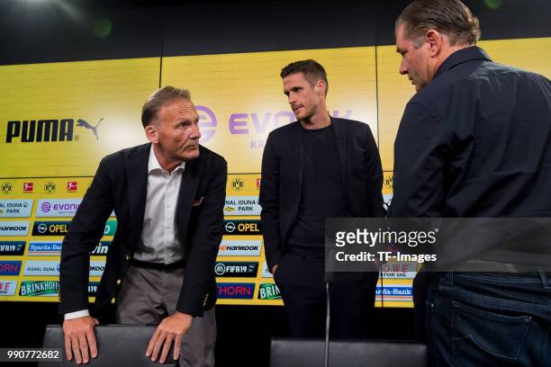 Hans-Joachim Watzke of Dortmund, Head of the Licensing Player Department Sebastian Kehl of Dortmund and Sporting director Michael Zorc of Dortmund...