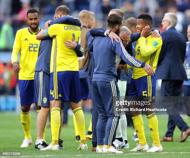 Andreas Granqvist and Martin Olsson of Sweden celebrate victory following the 2018 FIFA World Cup Russia Round of 16 match between Sweden and...