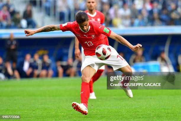 Switzerland's defender Ricardo Rodriguez kicks the ball during the Russia 2018 World Cup round of 16 football match between Sweden and Switzerland at...