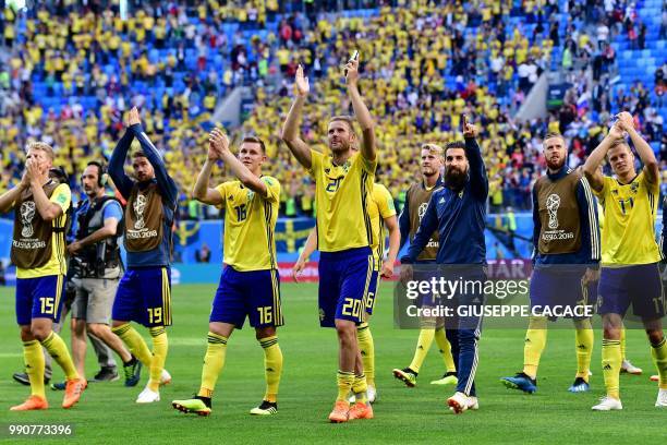 Sweden's players celebrate their victory in the Russia 2018 World Cup round of 16 football match between Sweden and Switzerland at the Saint...