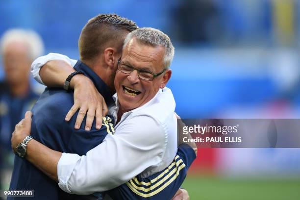 Sweden's coach Janne Andersson and Sweden's defender Pontus Jansson celebrate their victory at the end of the Russia 2018 World Cup round of 16...