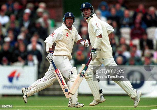 Graham Thorpe and Michael Vaughan of England clock up the runs during the Second Npower Test match between England and Pakistan at Old Trafford,...