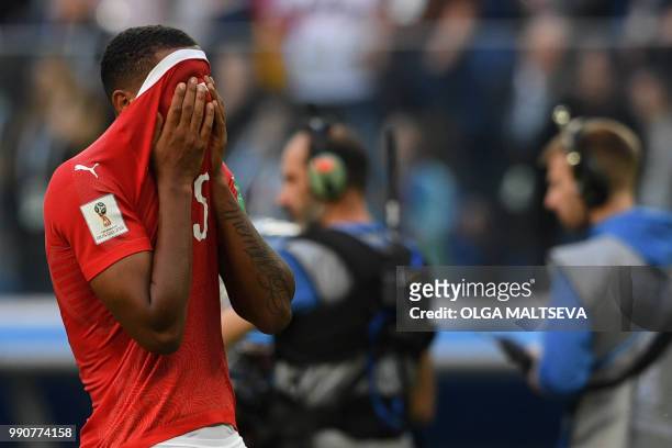 Switzerland's defender Manuel Akanji reacts after the team lost the Russia 2018 World Cup round of 16 football match between Sweden and Switzerland...