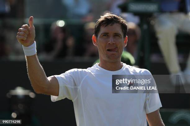 Australia's Matthew Ebden celebrates after beating Belgium's David Goffin 6-4, 6-3, 6-4 in their men's singles first round match on the second day of...