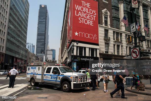 An NYPD vehicle sits outside Macy's in Herald Square following the investigation of a suspicious package, July 3, 2018 in New York City. Law...