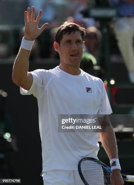 Australia's Matthew Ebden celebrates after beating Belgium's David Goffin 6-4, 6-3, 6-4 in their men's singles first round match on the second day of...