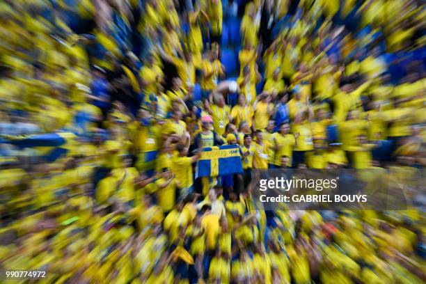 Sweden's fans celebrate at the end of the Russia 2018 World Cup round of 16 football match between Sweden and Switzerland at the Saint Petersburg...