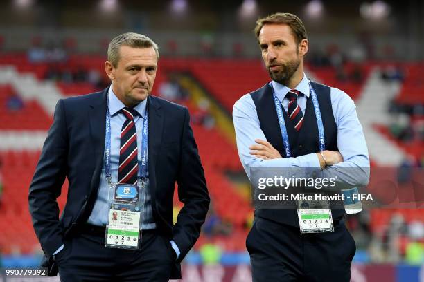 Gareth Southgate, Manager of England talks to his assistant Aidy Boothroyd during pitch inspection prior to the 2018 FIFA World Cup Russia Round of...