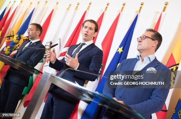 Austria's Interior Minister Herbert Kickl , Austrian Chancellor Sebastian Kurz and Austria's Vice Chancellor Heinz-Christian Strache attend a press...