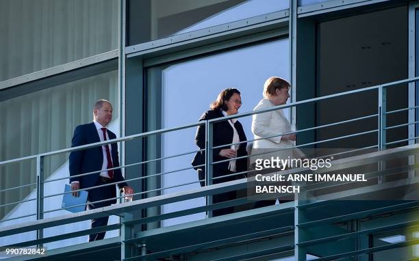 German Finance Minister and Vice-Chancellor Olaf Scholz, leader of the Social Democratic Party Andrea Nahles and German Chancellor and leader of the...