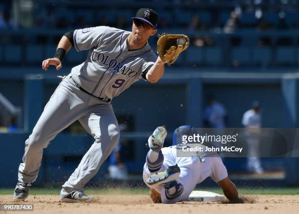 LeMahieu of the Colorado Rockies"n catches Austin Barnes of the Los Angeles Dodgers stealing in the sixth inning at Dodger Stadium on July 1, 2018 in...